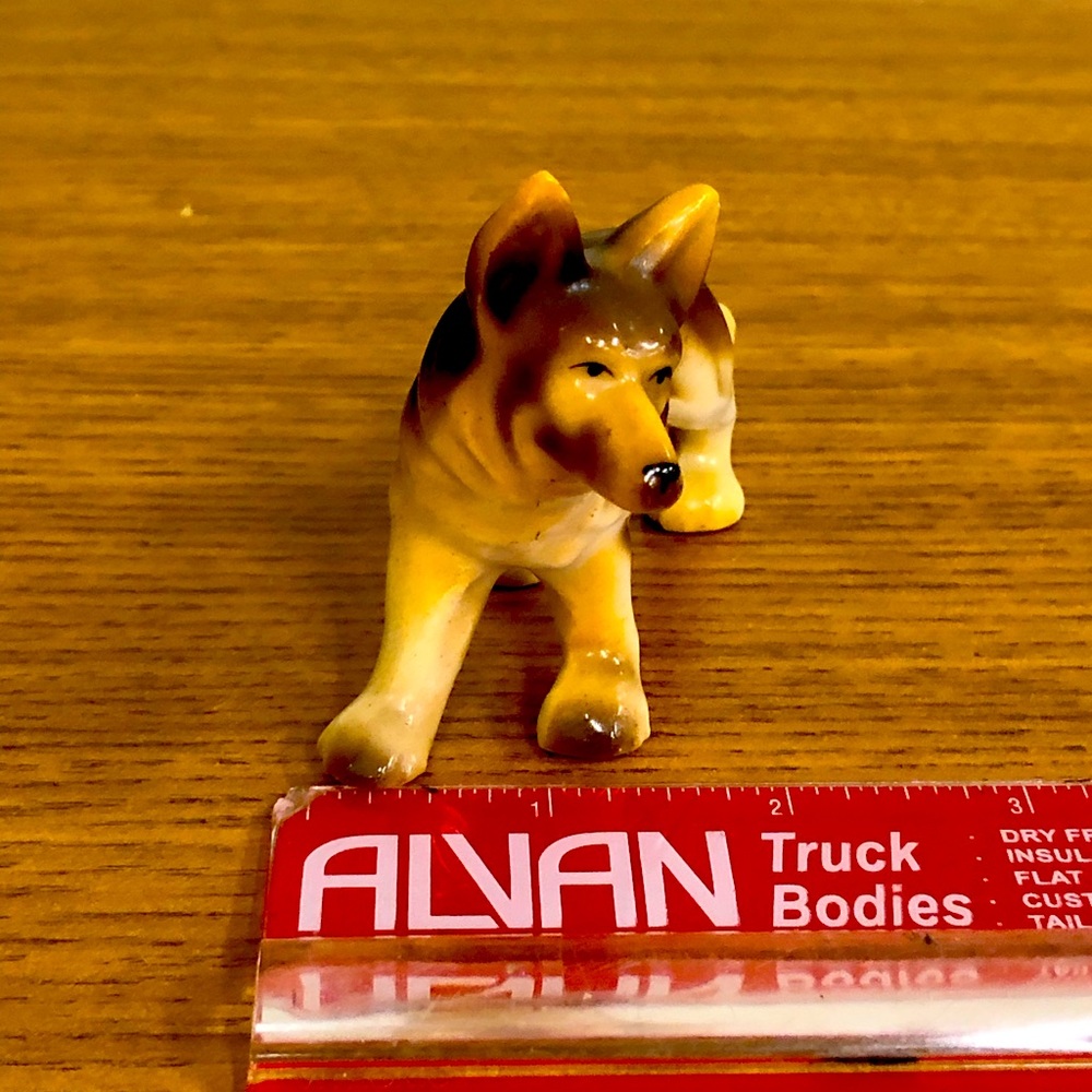 German shepherd figurine, gold overlay that says Lindsay Canada on the side
